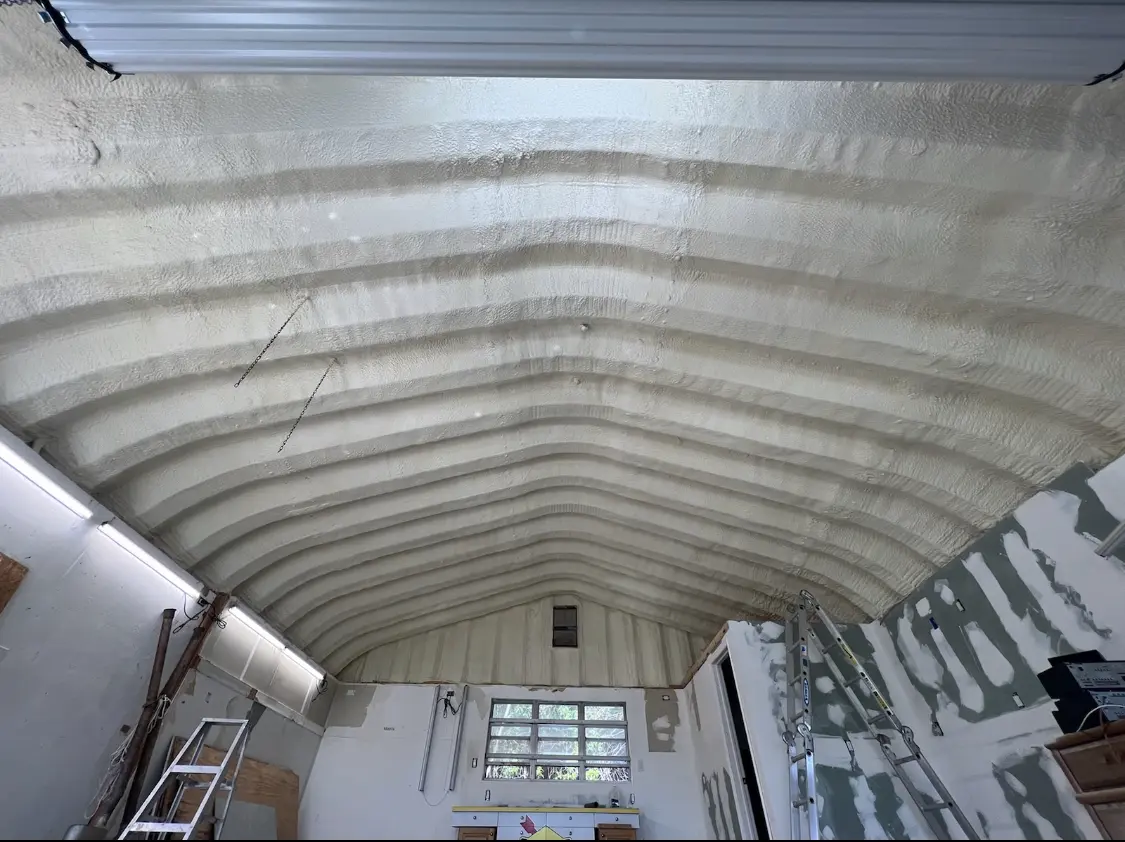 Spray polyurethane foam applied to the underside of a metal roof deck in Middleborough